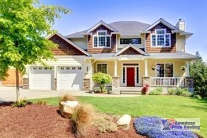 house with a shingle roof and cedar siding